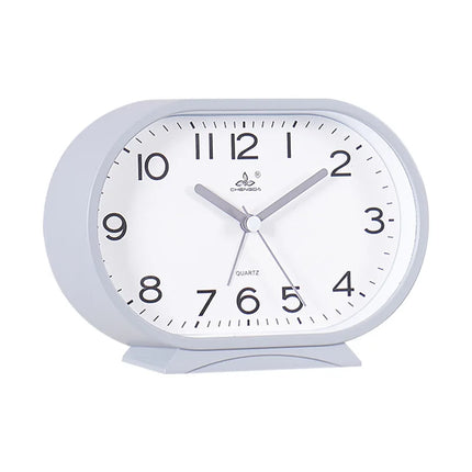 Oval og lydløs analog vekkerklokke