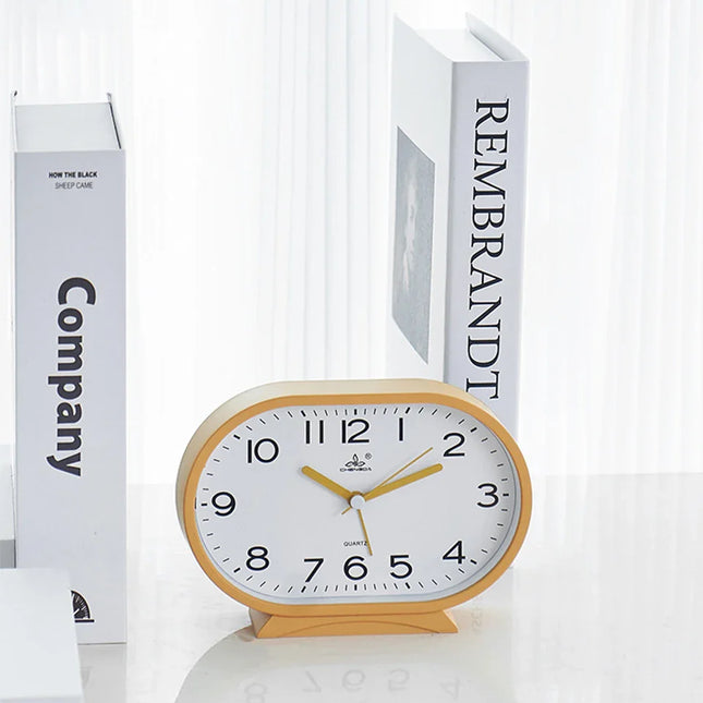 Oval og lydløs analog vekkerklokke