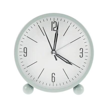 Liten stillegående analog reisevekkerklokke