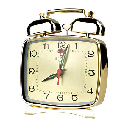 Liten mekanisk vekkerklokke med bjeller