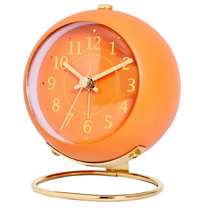 Oransje vintage vekkerklokke med gullstativ